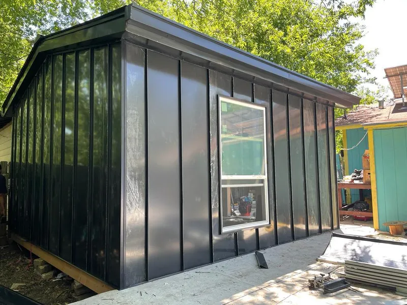 Black standing seam metal wall panels for Roof Inspection in Stafford