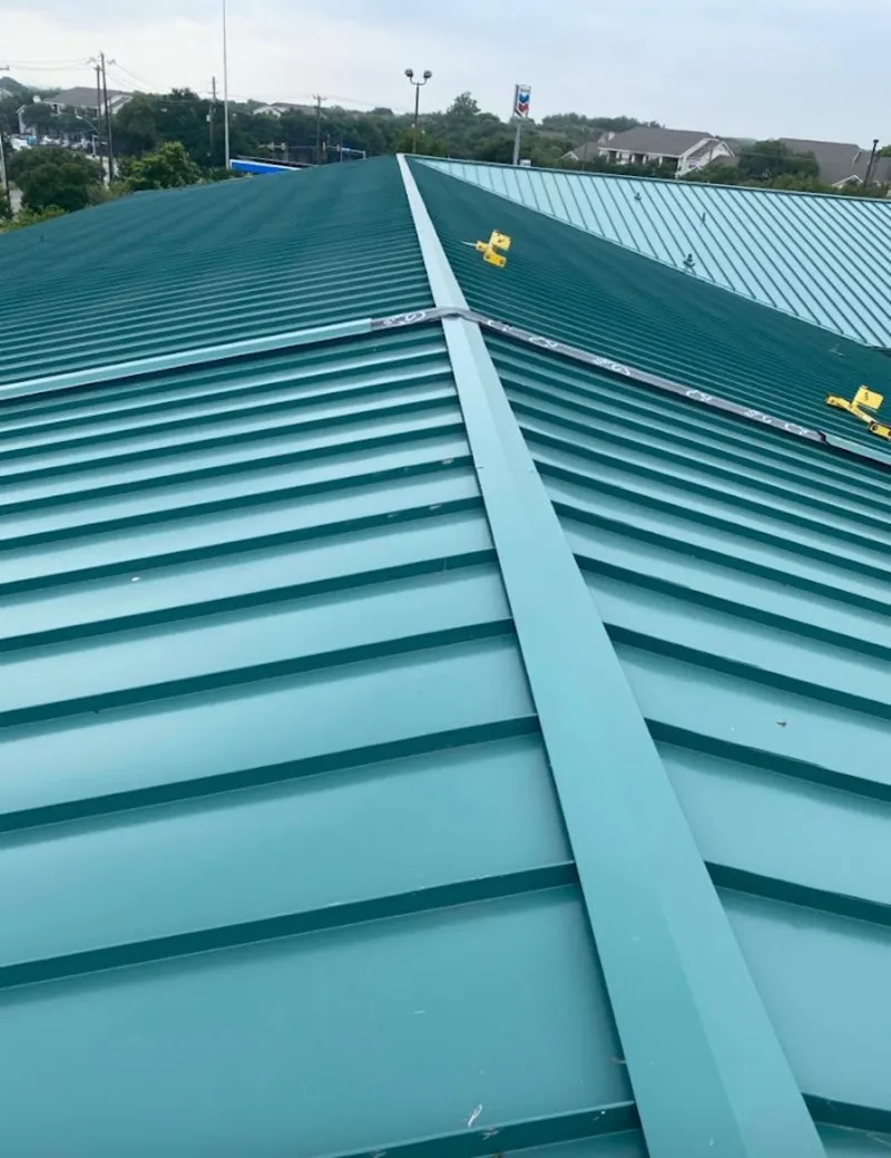 Green commercial metal roof ridge and valley for Metal Roof Repair in Stafford